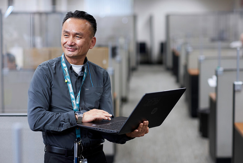 Employee using a laptop in an office