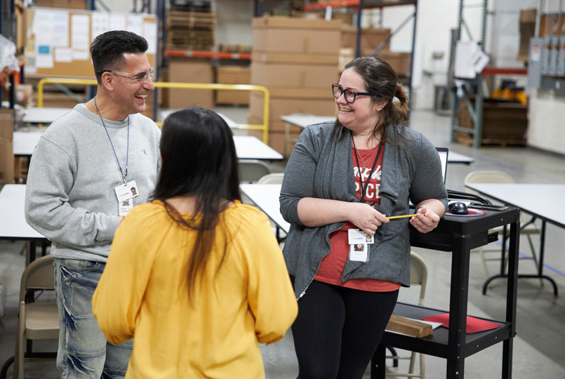 Three employees having a meeting